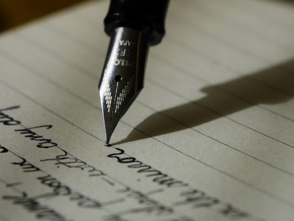 Writing on paper with a fountain pencil